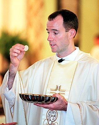 priest with wafer